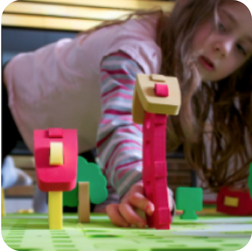 Little girl playing with blocks