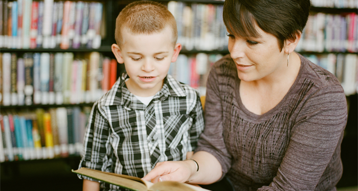Teacher helping child